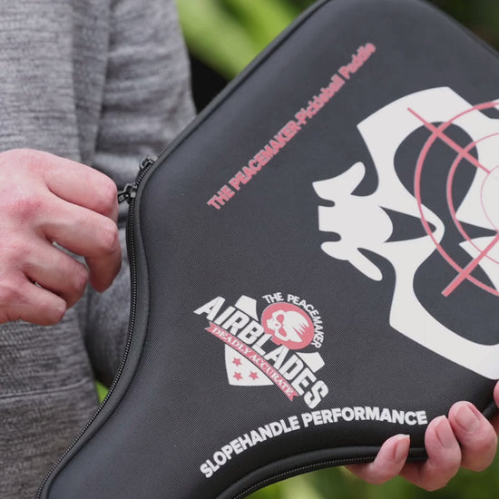 Video showing the AirBlades Peacemaker Pickleball Paddle being taken out of its protective hard case, highlighting the smooth edgeless carbon fibre design and the patented SlopeHandle grip engineered for comfort and control.